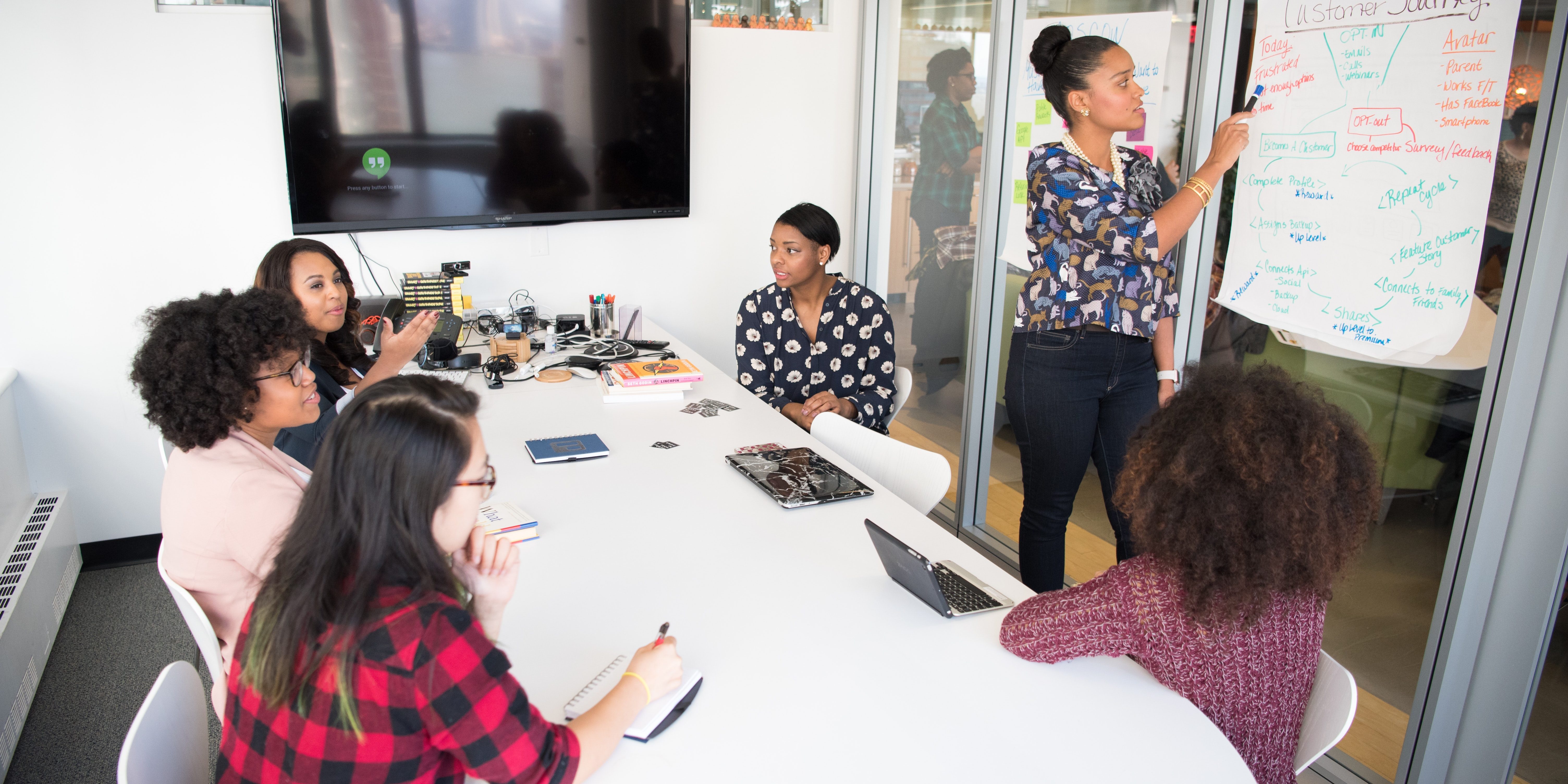 six-woman-standing-and-siting-inside-the-room-1181622